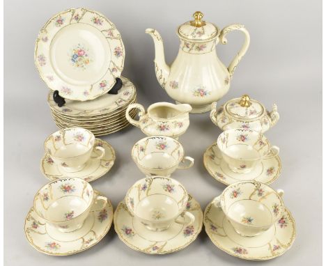 A German Floral Decorated Tea Set to Comprise Six Cups, Saucers, Side Plates, Teapot, Milk Jug and Sugar Bowl
