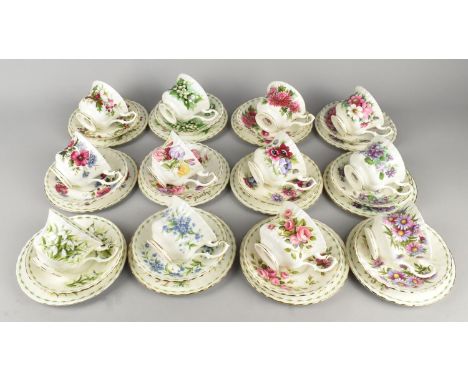 A Full Set of Twelve Royal Albert Flowers of the Month Series Tea Cups, Saucers and Side Plates