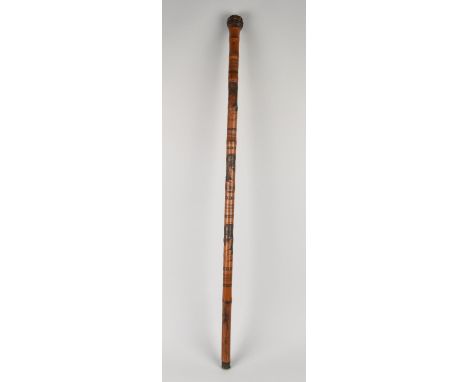 An Oriental Bamboo Walking Stick with Maiden Decoration, 90cms Long
