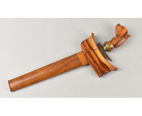 An Indonesian Kris Dagger with Wooden Handle and Scabbard, 25cms Long