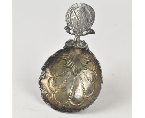 A Silver German Caddy Spoon with Scrolled Bowl to Earlier Thaler Coin Finial, the Bowl with British Import Mark, 10.5cm Long 