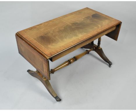 A Reproduction Mahogany Sofa Table on Castor Supports, 49cms High