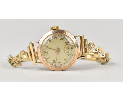 A 9ct Gold Cased Ladies Wrist Watch on Rolled Gold Bracelet Strap, Champagne Face with Arabic Numerals and Subsidiary Seconds
