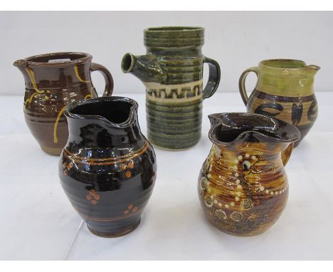 Five studio pottery jugs, one green glazed jug with studio pottery mark 'BP' to base, a Winchcombe pottery jug, makers mark '