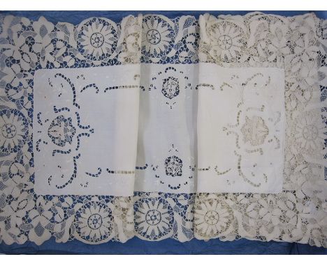 Cotton table runner with bobbin lace fringe with matching place mats and a square net cloth bordered with lace 