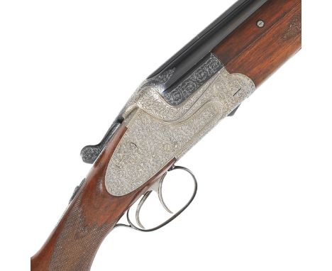A 12-bore 'Model 303E' sidelock over-and-under ejector gun by Gebruder Merkel, no. 46521The quadruple-grip bolstered action-b
