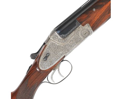 A 12-bore 'Model 203E' sidelock over-and-under ejector gun by Gebruder Merkel, no. 90619The quadruple-grip bolstered action-b
