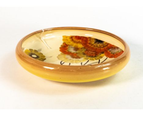 Clarice Cliff shallow circular bowl in the 'Rhodanthe' pattern, hand painted in brown and orange shades depicting stylised tr