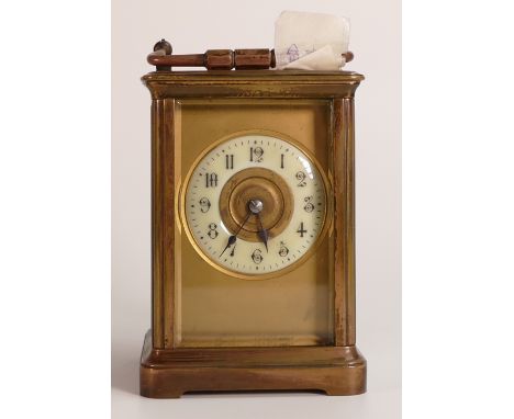 Mid-late 19th century brass carriage clock. bevelled glass panels to top and sides, Gothic numeral enamel dial face, with key
