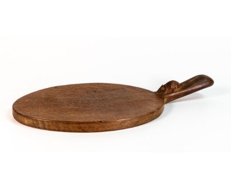 Robert 'Mouseman' Thompson solid English oak hand carved single handle cheeseboard. Oval form with diagonal handle. Measures 