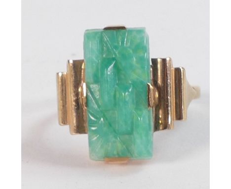 9ct gold and carved jade (or similar) oblong stone (17mm x 9mm),  Ring size Q/R, weight 4.49g. 