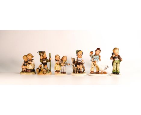 A collection of Goebel Hummel figures including Smart Little Sister, Mountaineer Hiking Boy, Goat Herder, Happy Days, Hello a