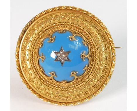 Edwardian circular memorial brooch with blue enamel &amp; diamond set centre with heavy foliate scroll border, unmarked but t