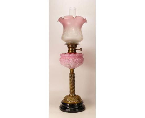 Victorian brass twisted column oil lamp with decorative pink Vaseline glass reservoir, chimney &amp; shade, height complete 6