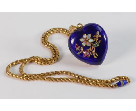 A Victorian enamel heart shaped pendant &amp; chain, the pendant heart shaped with blue enamel front set with opal, ruby, eme