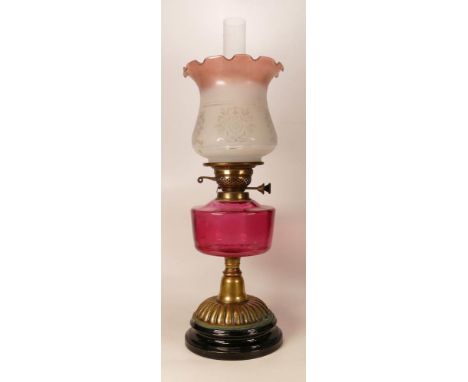 Victorian brass squat oil lamp with Cranberry glass reservoir, chimney &amp; shade, height complete 59cm 
