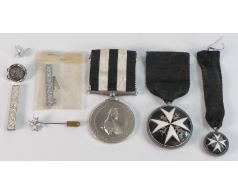 A collection of medals relating to St Johns Ambulance including Long Service Order of St John medal with clasps, tie pin and 