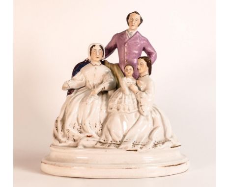 A Staffordshire figure portrait group, from the factory of Thomas Parr, likely depicting Queen Victoria and Prince Albert wit