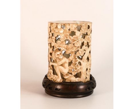 Royal Worcester reticulated vase decorated with a monkey, deer and bird in trees on a wooden stand. Height of vase 14.5cm 
