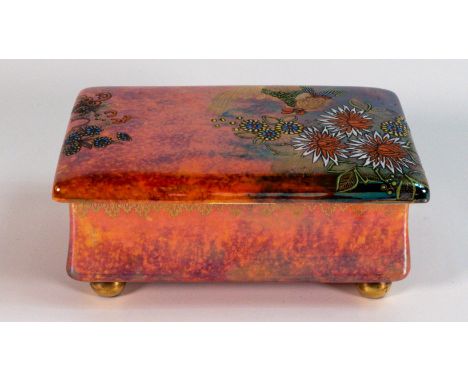 Carlton ware, Fighting Cocks pattern, lidded box with lustre and overglaze enamel decoration. Crazing and wear to gilding on 