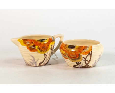 Clarice Cliff, cream jug &amp; sugar bowl in the 'Rhodanthe' pattern, hand painted in brown and orange shades depicting styli