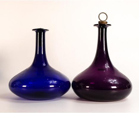 Georgian Mell decanters of squat ovoid form. One decanter in Bristol Blue and the other in Amethyst. Original corks, Amethyst