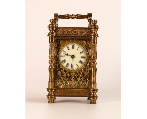 Exceedingly ornate brass carriage clock, late 19th century, no key, sold as not working.  15cm high inc. handle. 