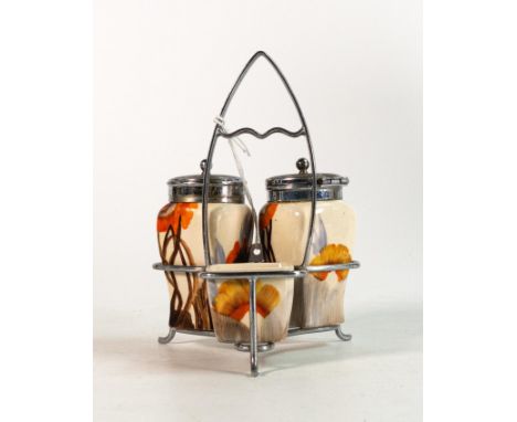 Clarice Cliff condiment set in the 'Rhodanthe' pattern, hand painted in brown and orange shades depicting stylised tree lands