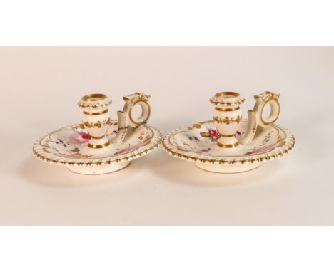 A pair of Grainger Lee &amp; Worcester circular chamber candlestick with floral and gilt decoration. Height 4.5cm, red painte