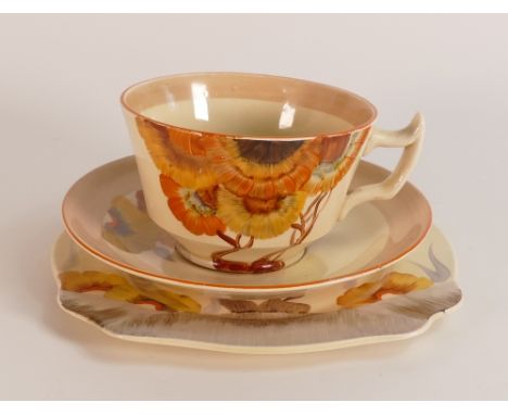 Clarice Cliff, tea trio in the 'Rhodanthe' pattern, hand painted in brown and orange shades depicting stylised tree landscape