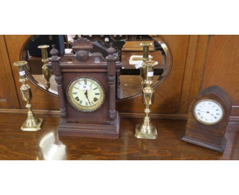 An oak cased mantle clock,two brass candlesticks and another mantle clock (4) Condition Report: Available upon request
