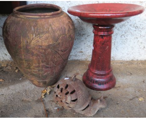 A modern ceramic bird bath, terracotta urn and a cast metal door stop in the form of a snail (3) Condition Report: Available 