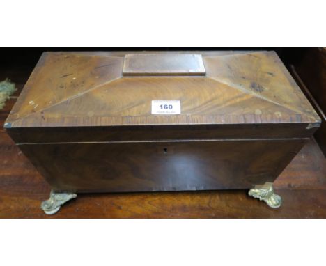 A 19th century mahogany and walnut veneered sarcophagus tea caddy with two lidded compartments flanking central mixing bowl C