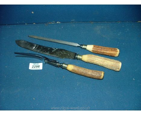 An Antler handle Carving set, steel knife and fork.