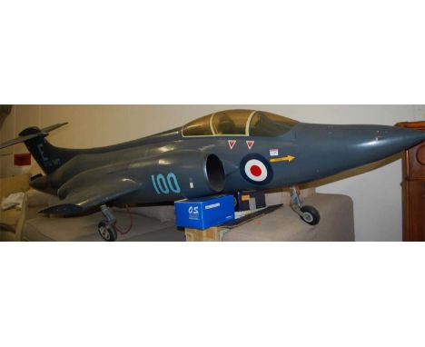 A very large balsawood and metal scale model of a Royal Navy Blackburn Buccaneer, finished in Royal Navy Blue, with RAF Round