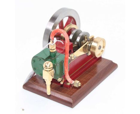 A well engineered horizontal steam engine, comprising of single cylinder with slip eccentric, fitted with take off and exhaus