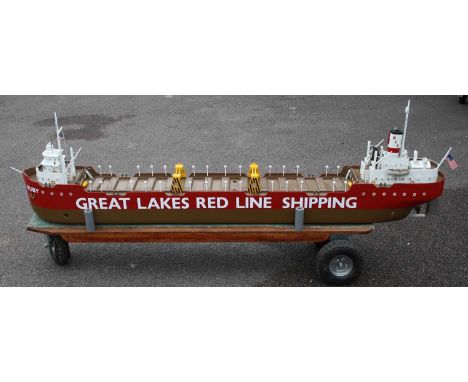 A wooden scratch built model of a Great Lakes Red Line Shipping “Ruby” container ship, of wooden construction with removable 