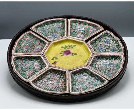 A nine piece "famille-verte" sweetmeat set, Qing dynasty, comprising a central octagonal saucer surrounded by eight barbed tr
