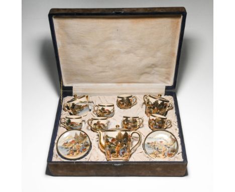 A Satsuma earthenware tea set, 20th century, each piece well painted with ladies sitting by blossoming iris in front of a pav