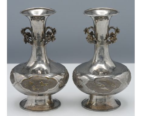 A pair of Chinese export silver Kangxi style vases, 19th century, each with the compressed ovoid body on a tall splayed foot 