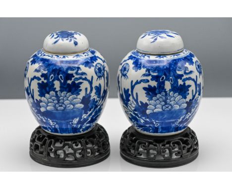 A pair of blue and white Kangxi style ginger jars and covers, 19th century, each of ovoid form and well painted in bright und