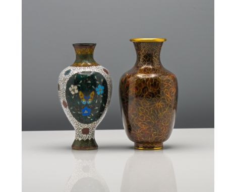 A small Chinese cloisonné enamel vase, early 20th century. Of baluster form, decorated with two ovoid panels of flowers reser
