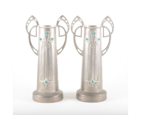 A pair of Jugendstil pewter and enamel vases, probably Austrian, circa 1900, the tapering bodies cast with stylised design, t