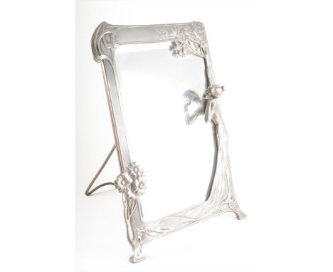 An Art Nouveau polished pewter figural toilet mirror, by WMF, circa 1905, cast in relief with a maiden aside a flowering tree