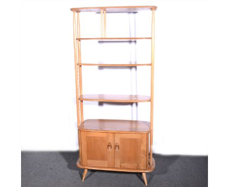 A light elm and beech room divider by Ercol, model 363, with fixed top shelf above two adjustable shelves above a cupboard, o