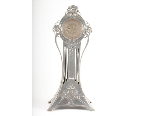 An Art Nouveau silvered metal mantel clock, WMF, circa 1900, the tall waisted form outlined with sinuous tendrils and cast wi