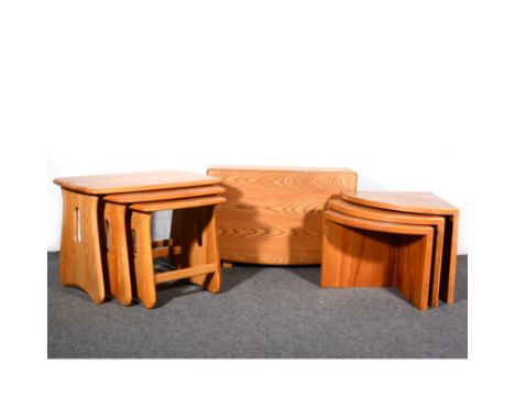 An elm and beech drop-leaf occasional table, by Ercol, gold button, max length 101cm, width 69cm, height 46cm; a nest of thre