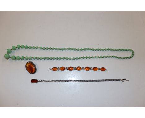 A 925 silver & amber brooch, 925 silver amber set bracelet, a amber pendant hung to 925 silver chain, a jade coloured bead ne