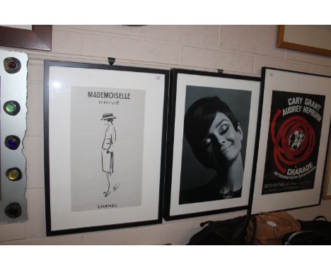 A framed print of Audrey Hepburn and a related Chanel print