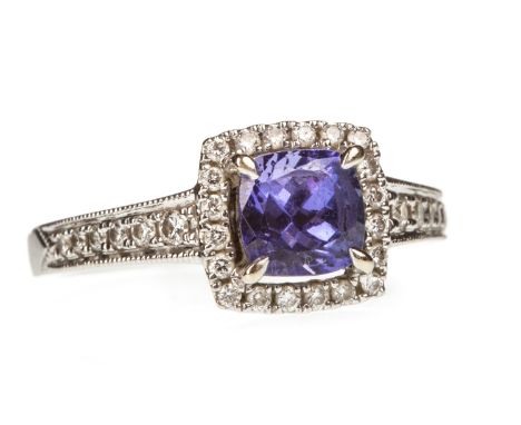 TANZANITE AND DIAMOND RING, the central cushion shaped tanzanite 5.7mm wide, within a square diamond halo, on diamond shoulde